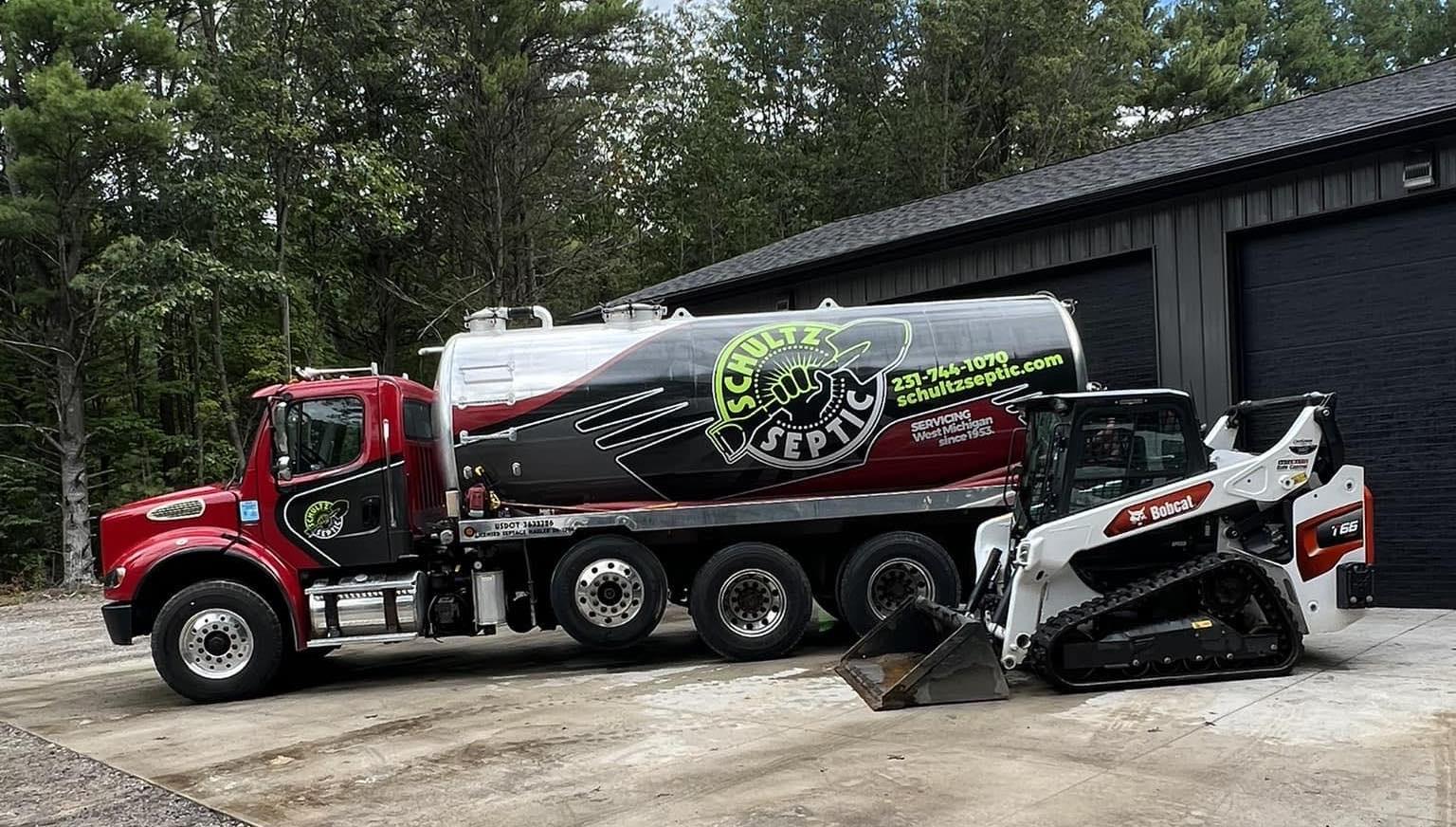 Schultz Septic service trucks at shop